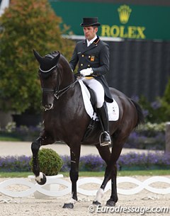 Severo Jurado Lopez on Marianne Helgstrand's Deep Impact. The black has a spectacular passage but the right hind is thrown out from under the body. The single tempi changes and extended canter were the highpoints