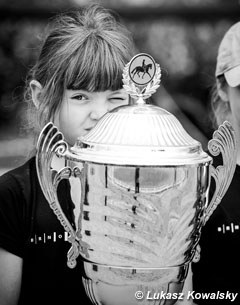 Small kid, big trophy
