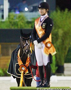 Carlos looks at his gold medal winning rider, Hannah Erbe