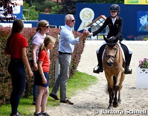 Lucie Anouk Baumgurtel gets a high five from trainer Wolfram Wittig