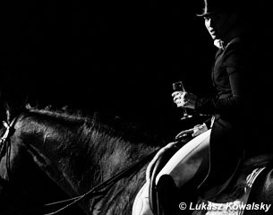 Morgan Barbançon on Sir Donnerhall II with a glass of champagne offered to every rider after his test