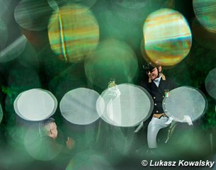 Norma Paoli photographed through a glass with champagne bubbles