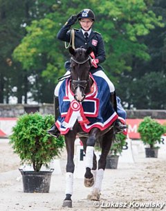 Zaneta Skowronska on Victory at the 2017 Polish Young Horse Championships :: Photo © Lukasz Kowalski