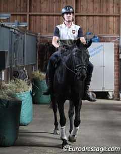 Johannes and Fortuny walking down the corridor. First time with a rider on top