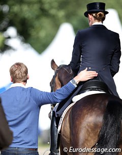Senta's life partner, Finnish Grand Prix rider Henri Ruoste, gives his girlfriend a pat in the back