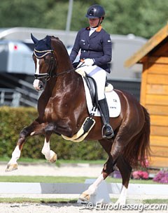 Dana van Lierop on Gunner KS (by Belissimo M x Vincent). He scored 9.4 for the breath taking, uphill canter. The horse was a bit wild though, as he kicked to the spur and was not entirely relaxed in the contact