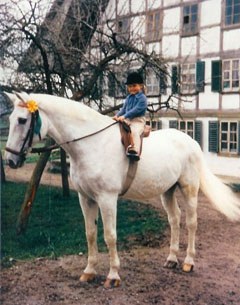 Stephan in his retirement at Katja's place in Berne, carrying Katja's daughter Ewa around