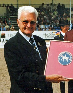 Anton Fischer receives a plaque from the International Dressage Trainers Club at the 1998 CDIO Aachen