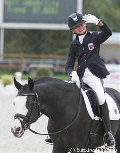 Luxembourg Fabienne Claeys on Domino. She scored 61.895% but looked more happy than most riders do when they get 70%.