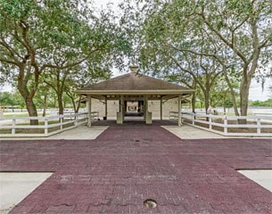 One of the covered wash stall areas with ceiling fans and attached paddocks 