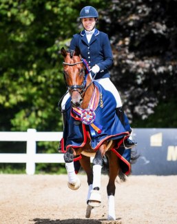 Michele Bondy and Sonnenberg's Kain win the 4-yo division at the 2019 U.S. Dressage Championships :: Photo © USEF