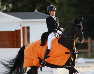 German Luna Laabs is all smiles while her horse Wild Willy Granly goes for a major sprint in the victory lap for the Young Riders Team test at the 2020 CDI Grote Brogel :: Photo © Astrid Appels