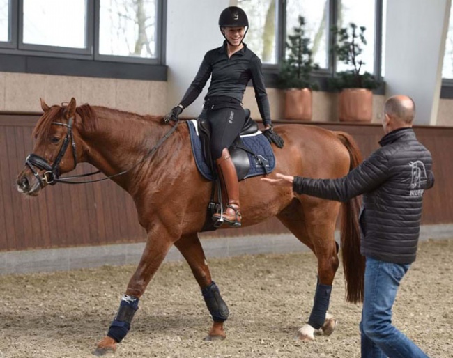 Agnete Kirk Thinggaard on Blue Hors Veneziano with coach Lars Petersen by her side :: Photo © Ridehesten