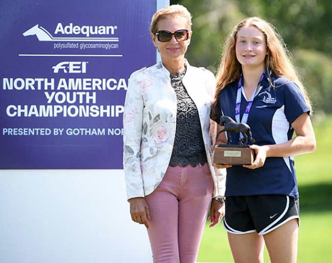 Judge Maja Stukelj handing the Dressage Style Award to Abby Fodor at the 2019 NAYC