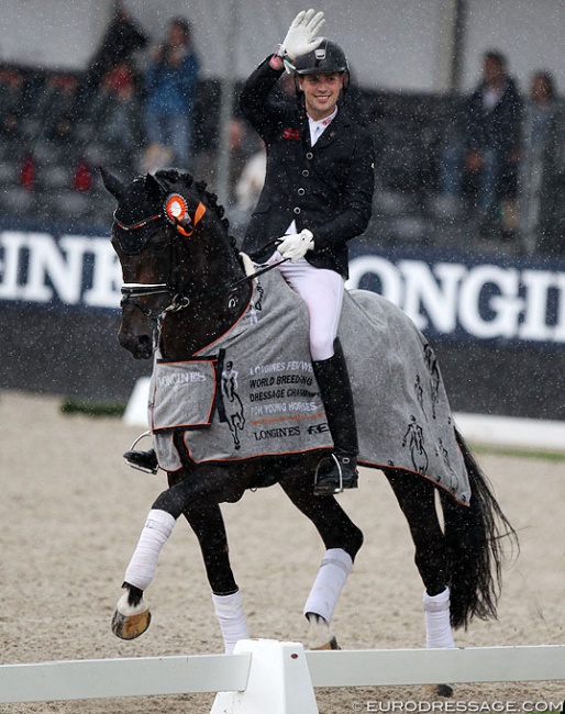 Frederic Wandres and Zucchero in a rainy lap of honour at the 2019 World Young Horse Championships :: Photo © Astrid Appels