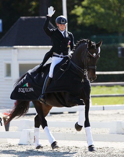 Nicolas Wagner riding the lap of honour on his sister Charlotte Remy's Herkules at the 2019 CDI Waregem :: Photo © Astrid Appels