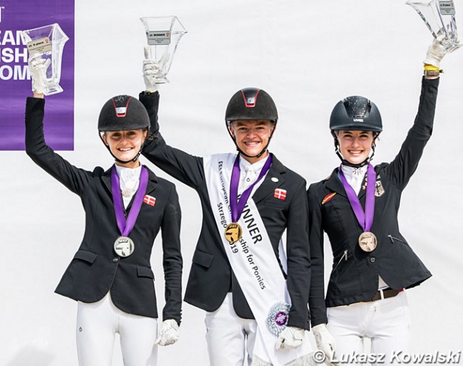 The individual podium with Liva Addy Guldager Nielsen, Alexander Yde Helgstrand, Shona Benner at the 2019 European Pony Championships, which were also hosted in Strzegom :: Photo © Lukasz Kowalsi