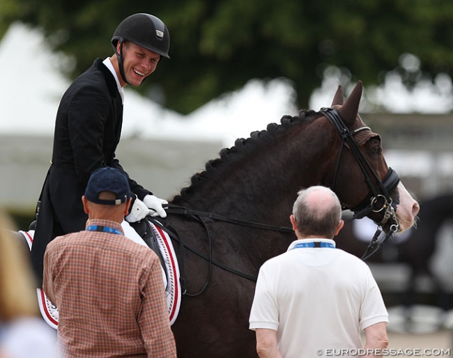 Daniel Bachmann Andersen and Blue Hors Don Olymbrio at the 2019 CDIO Aachen talking to trainer Lars Petersen and Blue hors owner Kjeld Kirk Kristiansen after his ride :: Photo © Astrid Appels