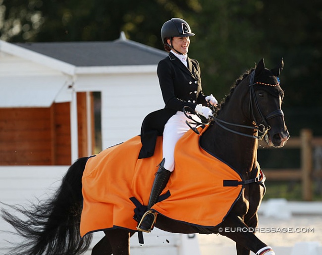 German Luna Laabs is all smiles while her horse Wild Willy Granly goes for a major sprint in the victory lap for the Young Riders Team test at the 2020 CDI Grote Brogel :: Photo © Astrid Appels