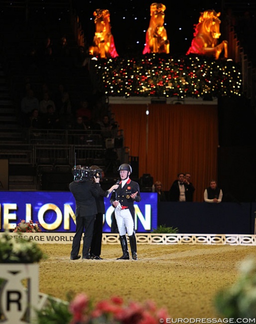 Richard Davison getting interviewed after riding the new Short Grand Prix test at the 2019 CDI-W London :: Photo © Astrid Appels