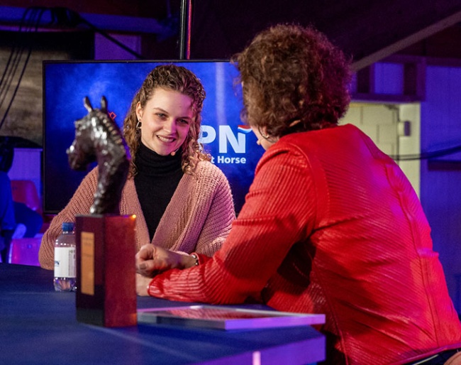 Jasmijn van der Velden picks up the Jazz Trofee which her late grand father Joop Rodenburg received for breeding the 2020 KWPN Horse of the Year, Glamourdale :: Photo © Dirk Caremans