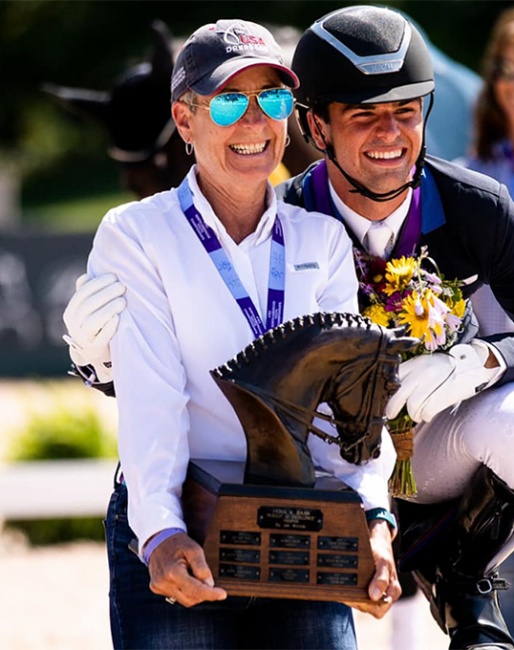 Roberta Williams, here with young rider Christian Simonson and the Fiona Baan trophy at the 2021 North American Youth Championships :: Photo © USEF