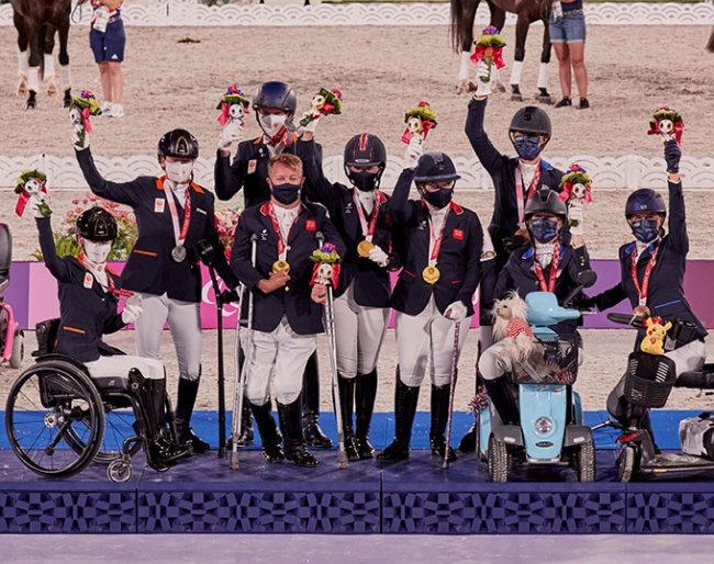 Celebrations on the podium at Equestrian Park tonight at the Tokyo 2020 Paralympics with the winners of the team competition. L to R: Rixt van der Horst - Findsley, Sanne Voets - Demantur, Frank Hosmar - Alphavile (NED) Silver medalists; Lee Pearson - Breezer, Sophie Wells - Don Cara M, Natasha Baker - Keystone Dawn Chorus (GBR) Gold medalists; Kate Shoemaker - Solitaer 40, Roxanne Trunnell - Dolton, Rebecca Hart - El Corona Texel (USA) Bronze medallists. (FEI/Liz Gregg)