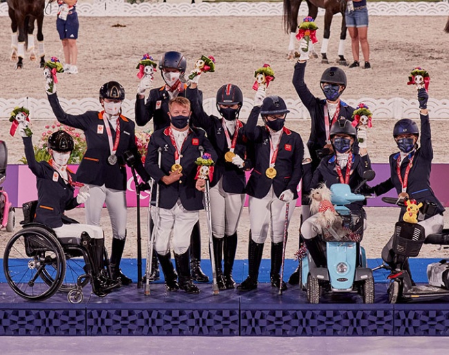 Celebrations on the podium at Equestrian Park tonight at the Tokyo 2020 Paralympics with the winners of the team competition. L to R: Rixt van der Horst - Findsley, Sanne Voets - Demantur, Frank Hosmar - Alphavile (NED) Silver medalists; Lee Pearson - Breezer, Sophie Wells - Don Cara M, Natasha Baker - Keystone Dawn Chorus (GBR) Gold medalists; Kate Shoemaker - Solitaer 40, Roxanne Trunnell - Dolton, Rebecca Hart - El Corona Texel (USA) Bronze medallists. (FEI/Liz Gregg) 