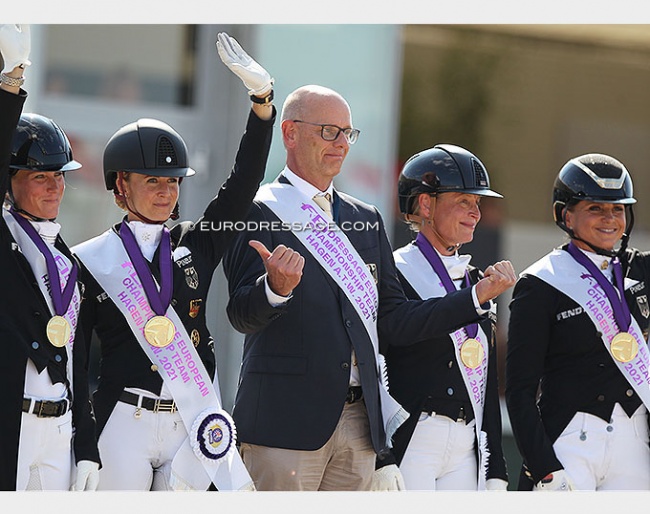 German chef d'equipe Klaus Roeser points at Germany's golden girls at the 2021 European Dressage Championships :: Photo © Astrid Appels