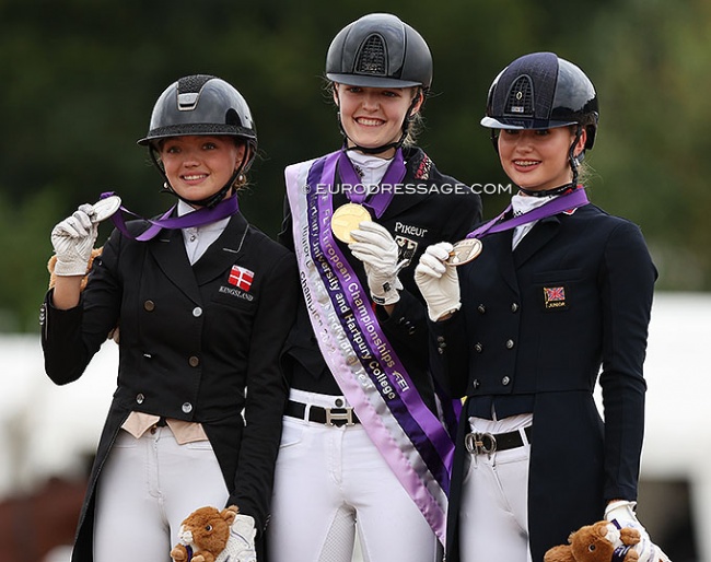 Sophia Obel Jorgensen, Allegra Schmitz-Morkramer, and Annabella Pidgley on the individual test podium at the 2022 European Junior Riders Championships :: Photo © Astrid Appels