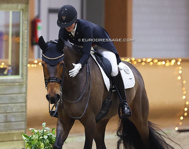 Cathrine Dufour pats the British owned Mount St. John Freestyle after their 81% earning show debut at the 2023 CDI Kronenberg :: Photo © Astrid Appels