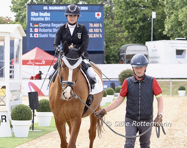 Germany’s Julia Porzelt being led around by Bendix Eichholz before her start with Bruno at the 2024 CPEDI Mannheim :: Photo © Silke Rottermann