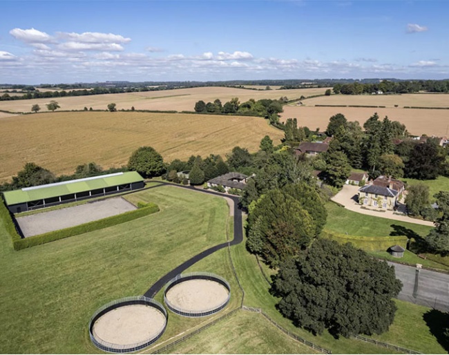 A well-appointed country house with an extensive equestrian facility including a bespoke indoor and outdoor school. 