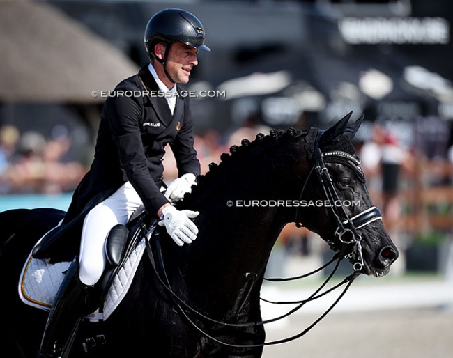 Justin Verboomen patting Zonik Plus after a winning test at the 2026 CDIO Lier :: Photo © Astrid Appels